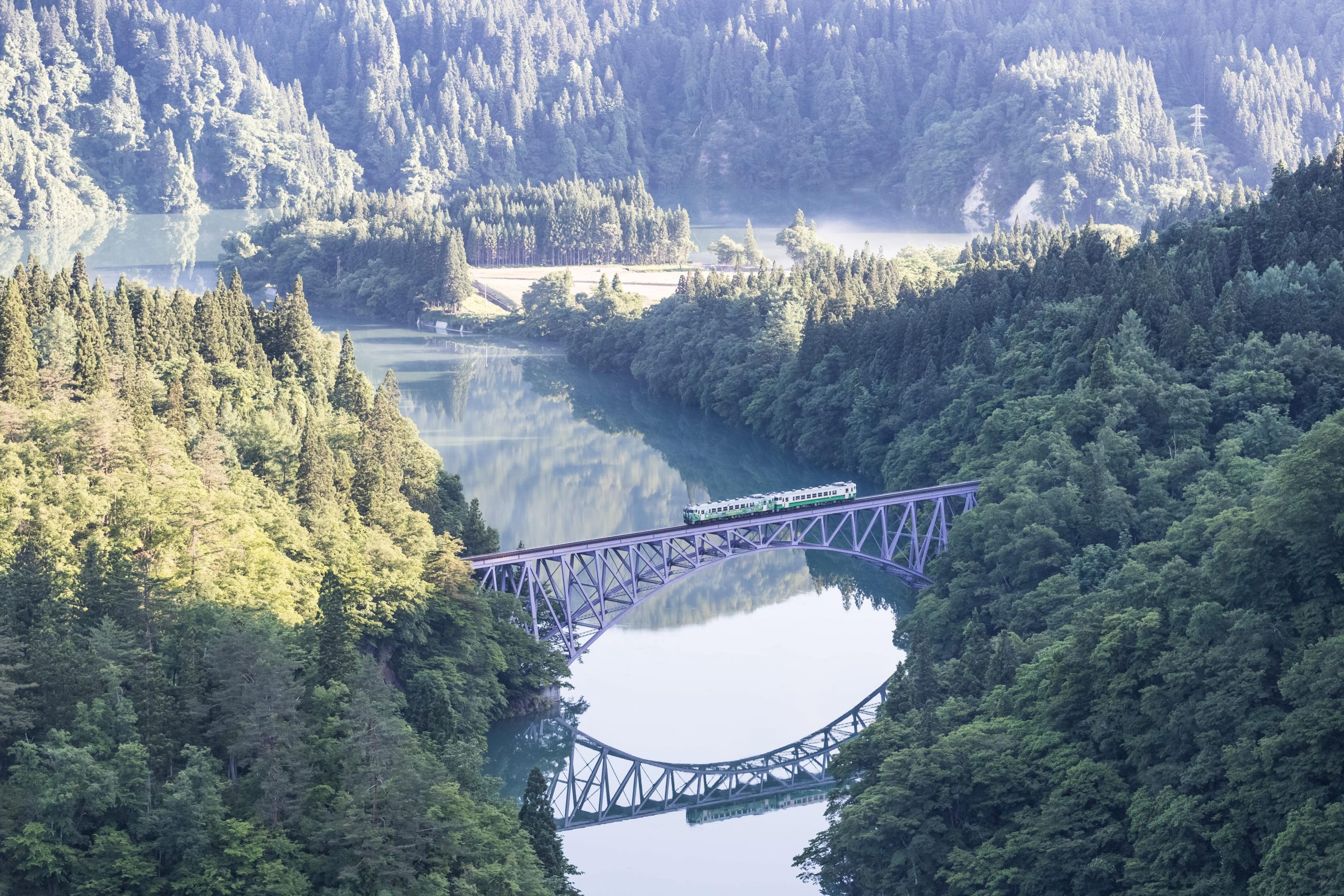 The local train Tadami line and the Tadami river.
