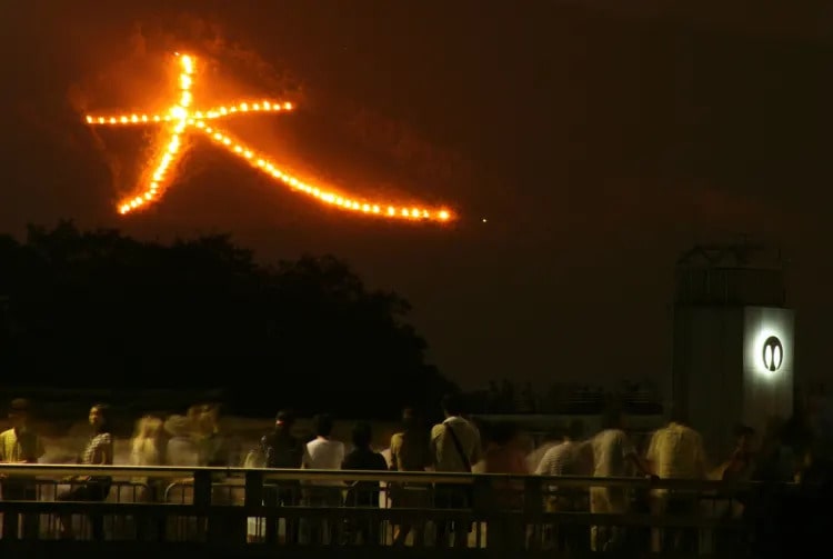 Five giant bonfires are lit on the mountains surrounding the city.