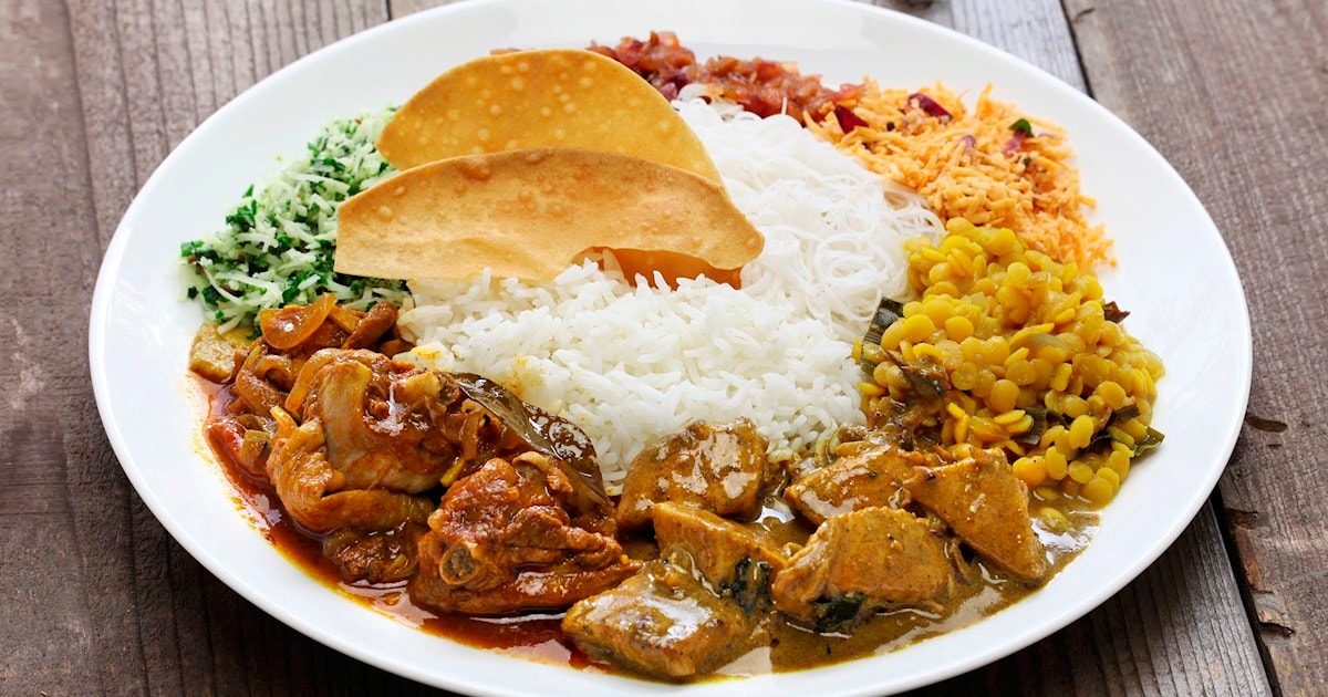 A typical "Rice and Curry" meal consists of a mound of steaming hot rice (often red, white, or samba varieties).