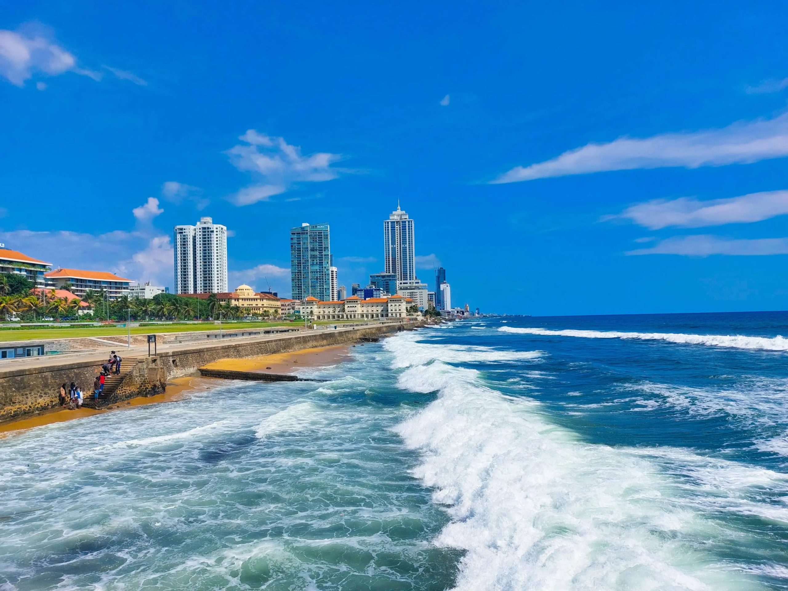 The area is a popular spot for people to walk, fly kites, and enjoy the ocean breeze and waves.