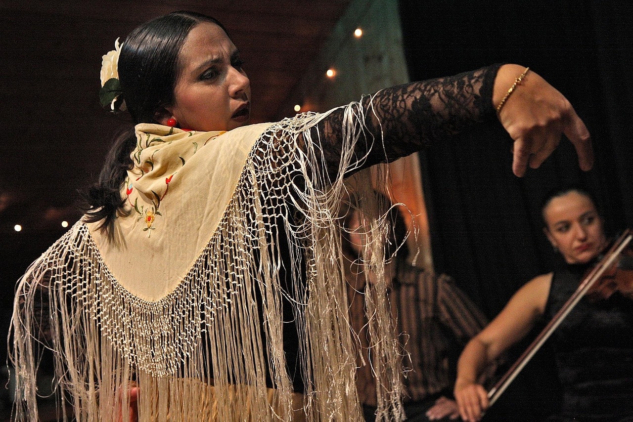 The dance is known for its expressive hand movements and rhythmic footwork.