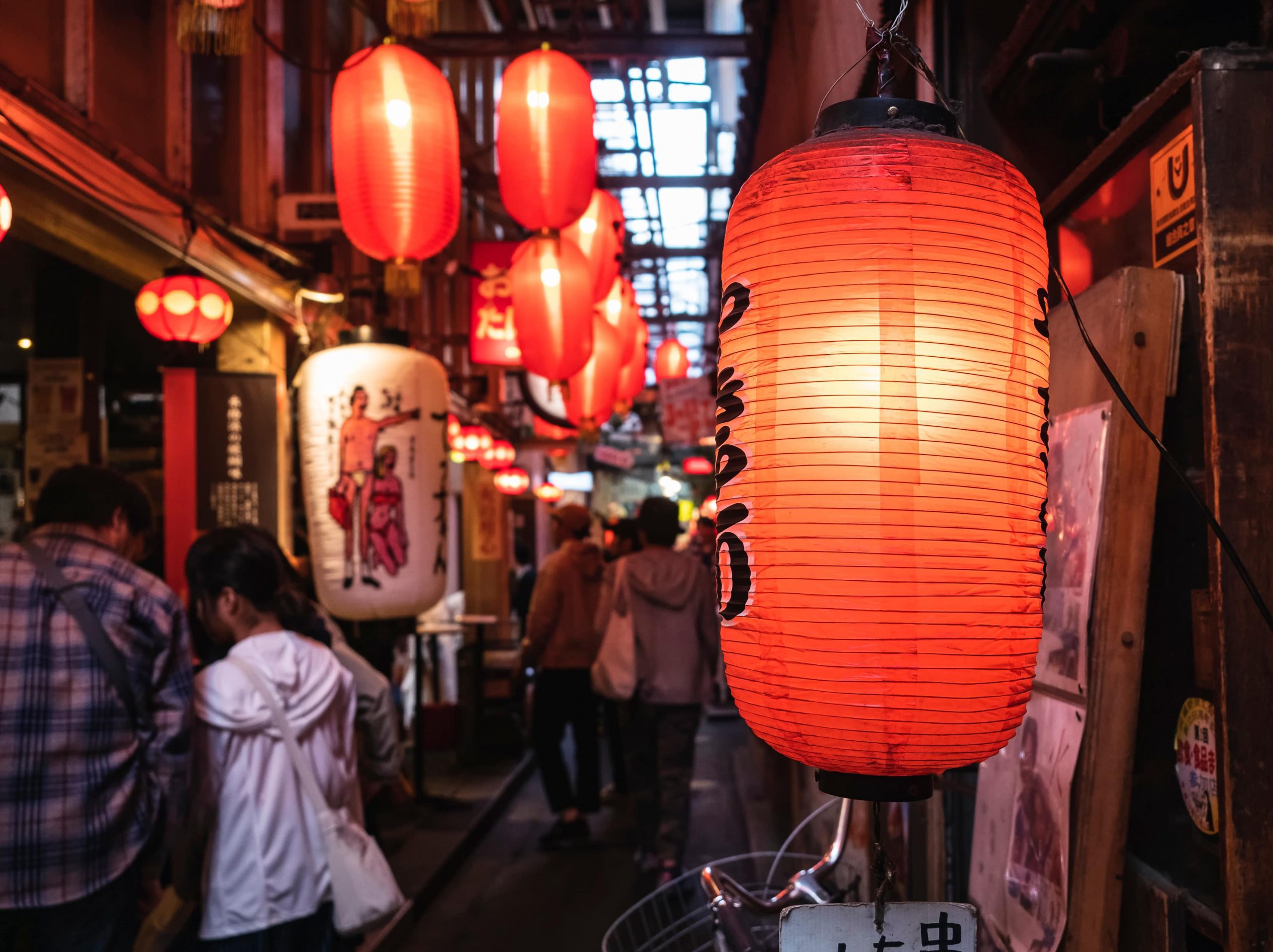 Japan Bar street Izakaya Red light sign with people drinking.
