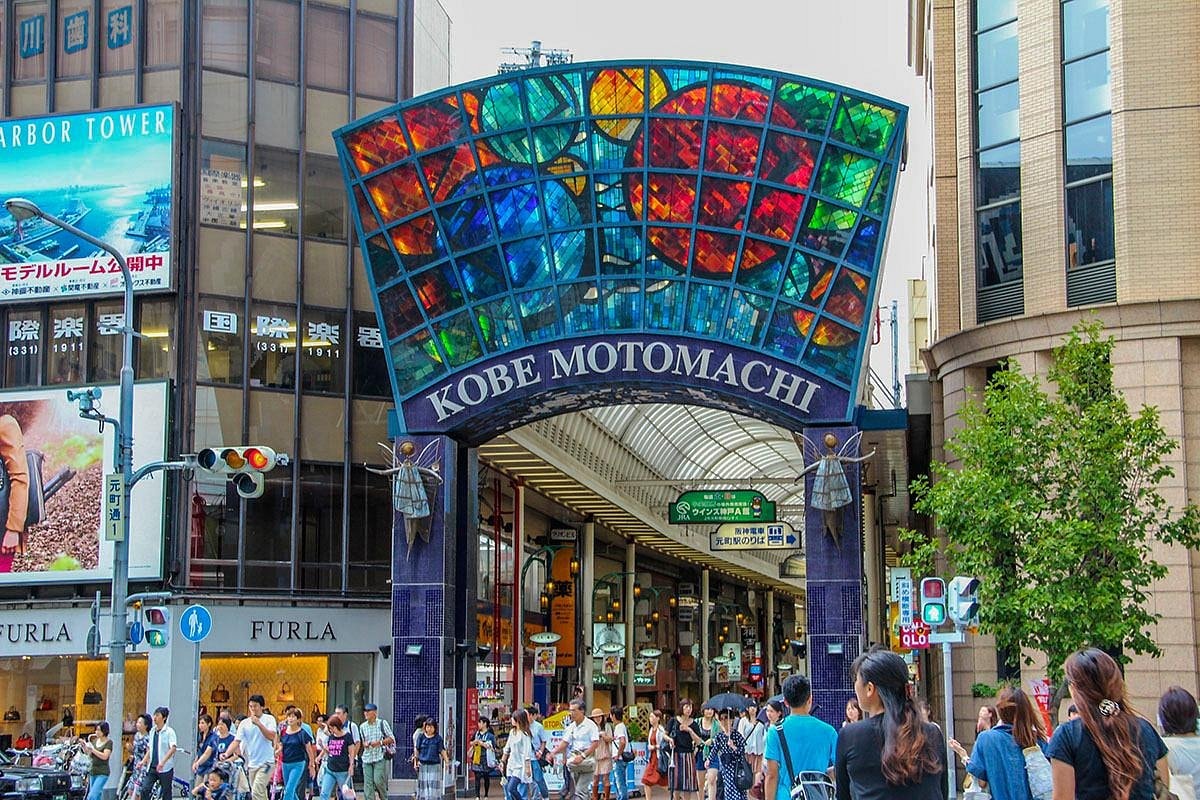 The street is a covered shopping arcade, providing a sheltered environment for pedestrians.
