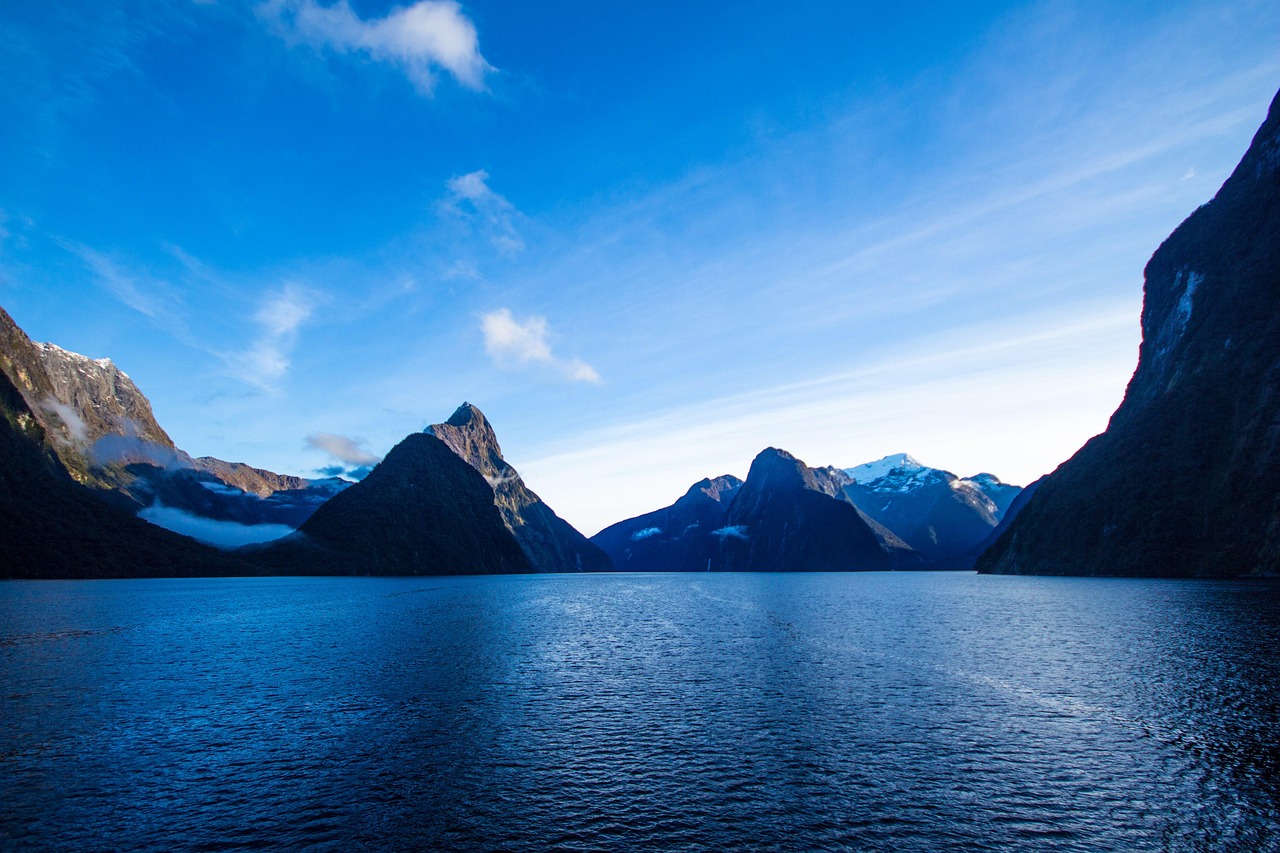 Milford Sound: A view of misty peaks and tranquil waters, often called the Eighth Wonder of the World.