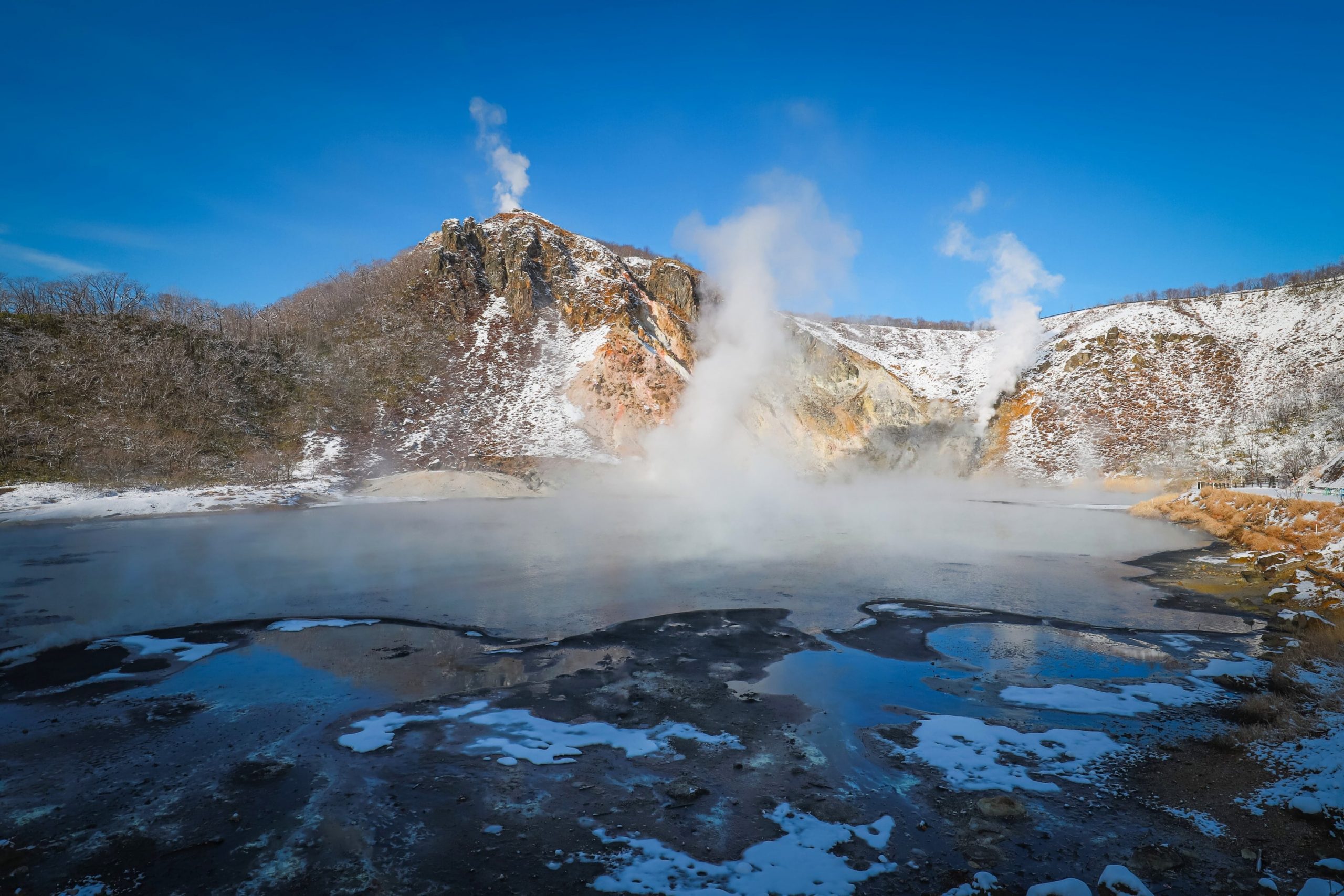 The Jigokudani Observation Deck provides a panoramic view of the entire valley.