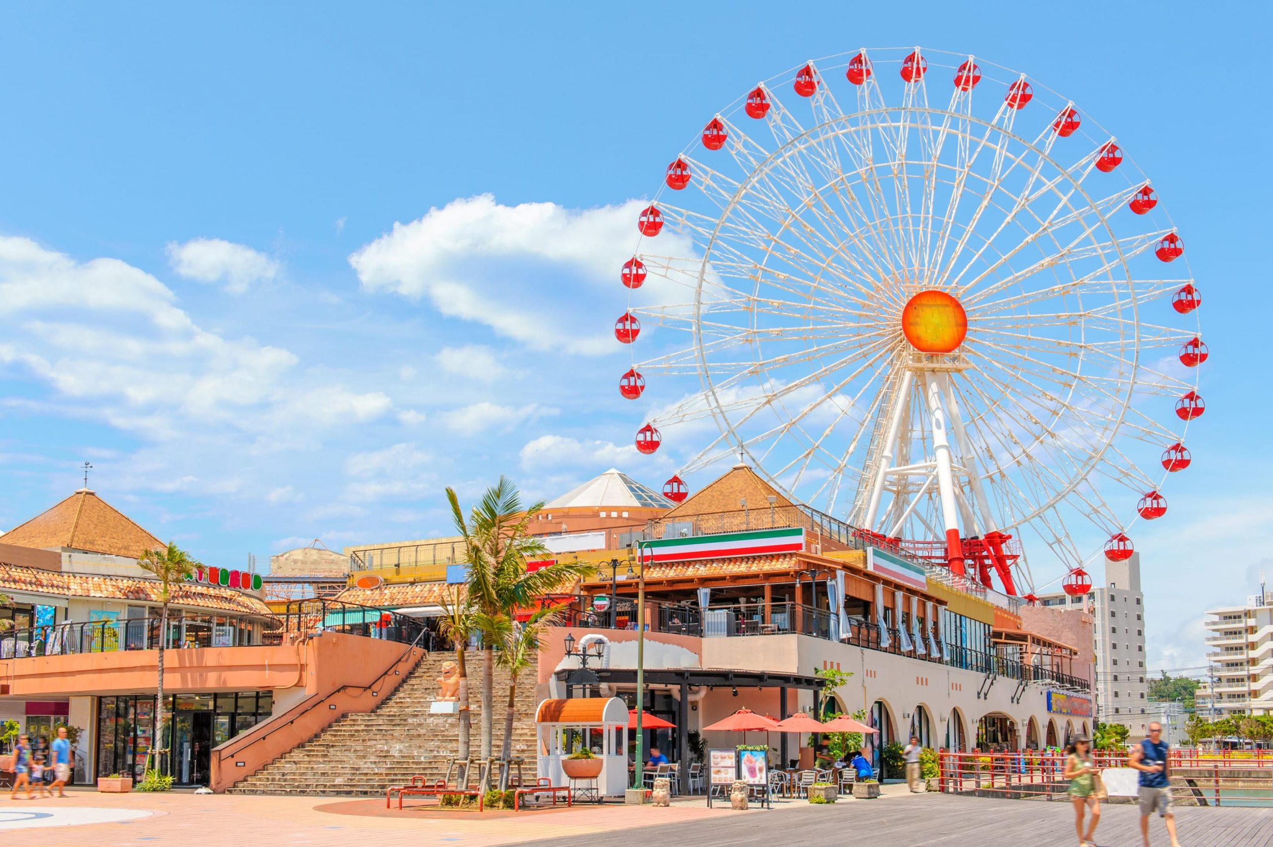 The complex includes a large Ferris wheel, a movie theater, a bowling alley, and live music venues.