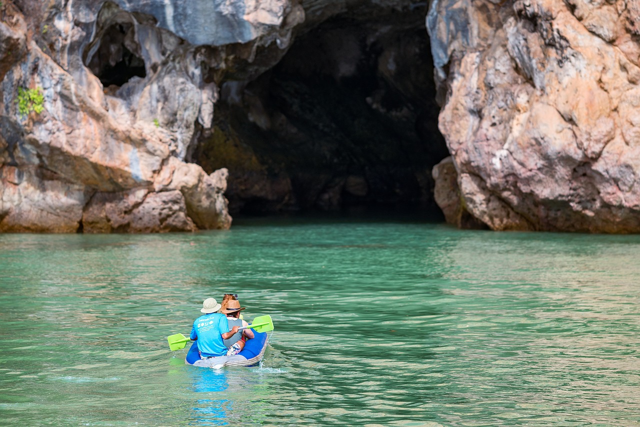Adventurers kayak through hidden sea caves and azure lagoons, discovering the vibrant marine world within.