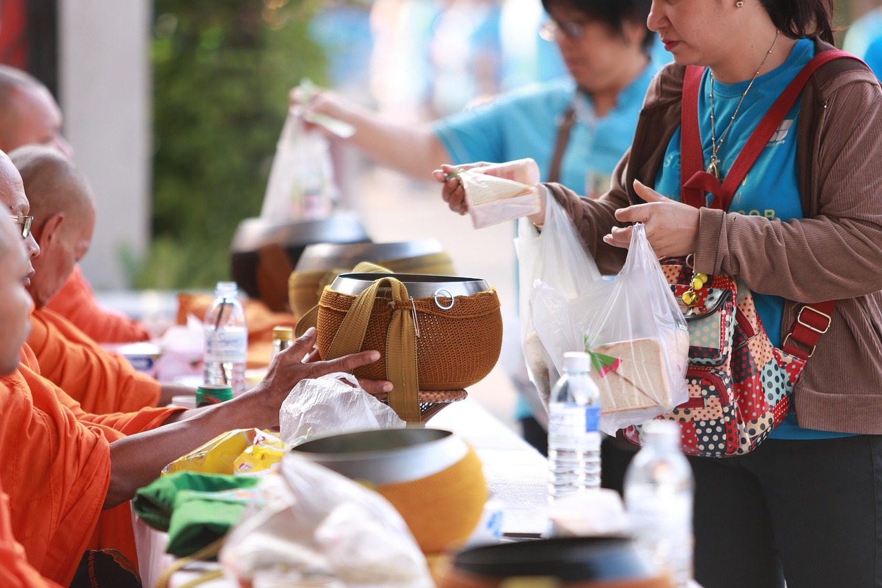 Participate in local traditions: Morning alms-giving rituals at the temple’s heart.