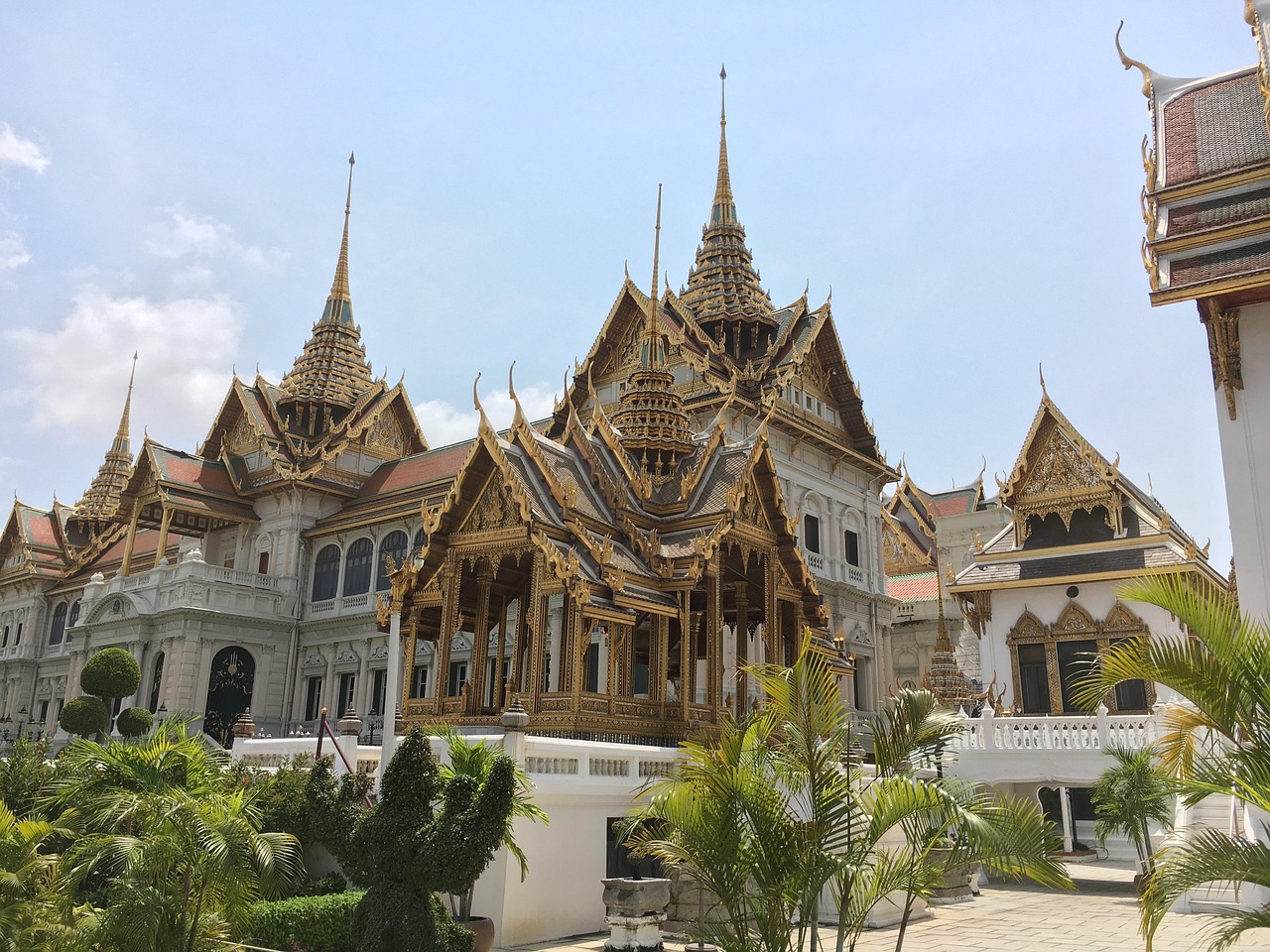 The radiant spires of the Grand Palace shine as Bangkok awakens.