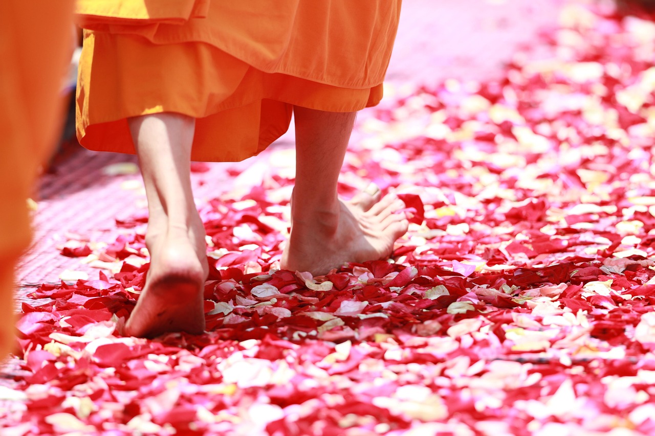 An orange-robed monk bestows blessings during a special palace ceremony.