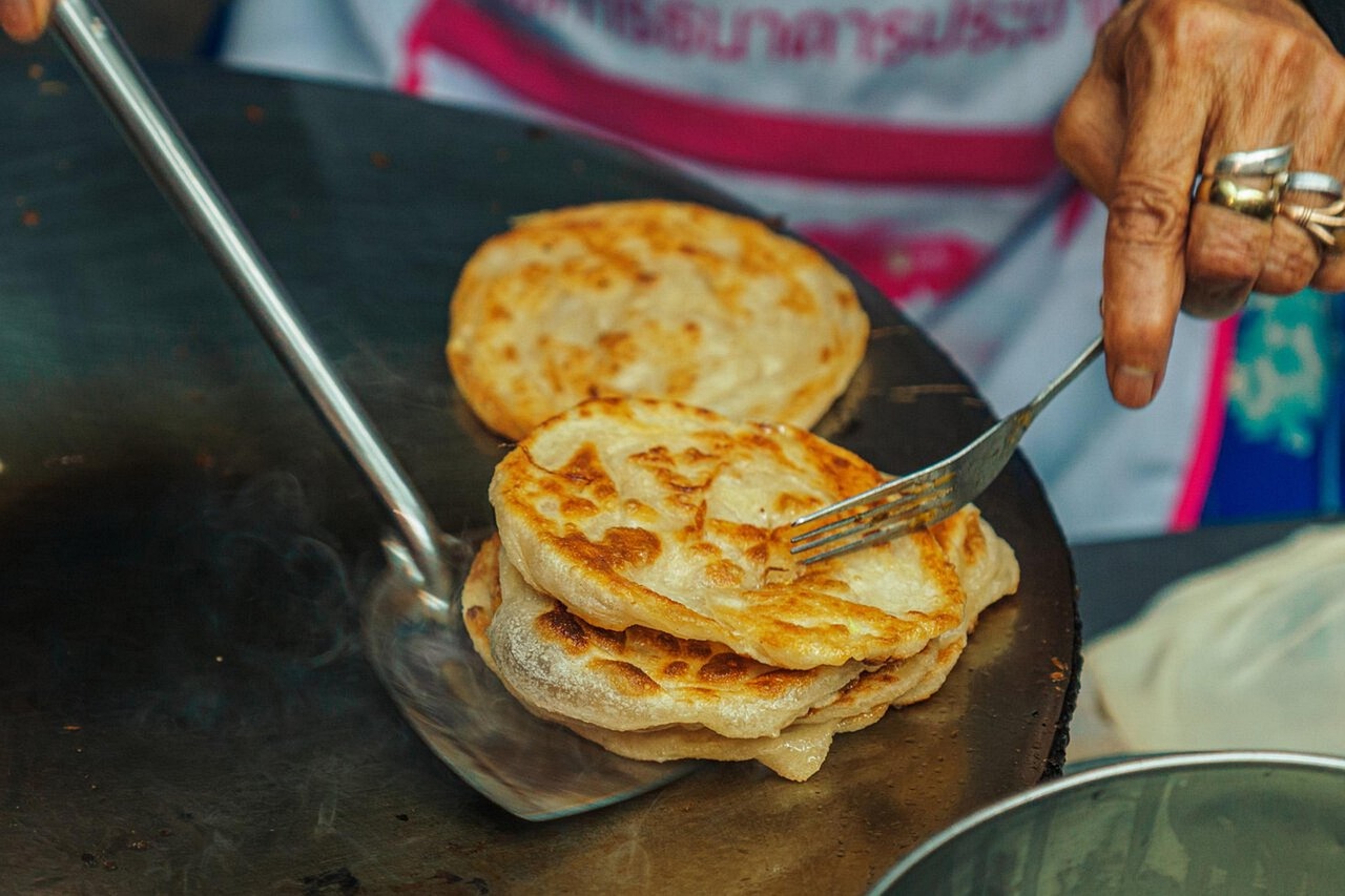 Uncover local culture and flavours at a vibrant Thai night market on Phangan Island.