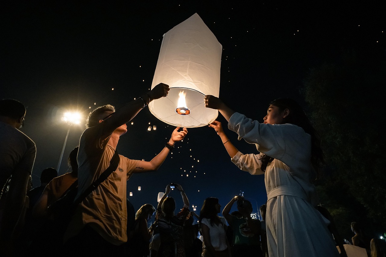 Thousands of lanterns ascend during Yi Peng, illuminating Chiang Mai's night sky with dreams.