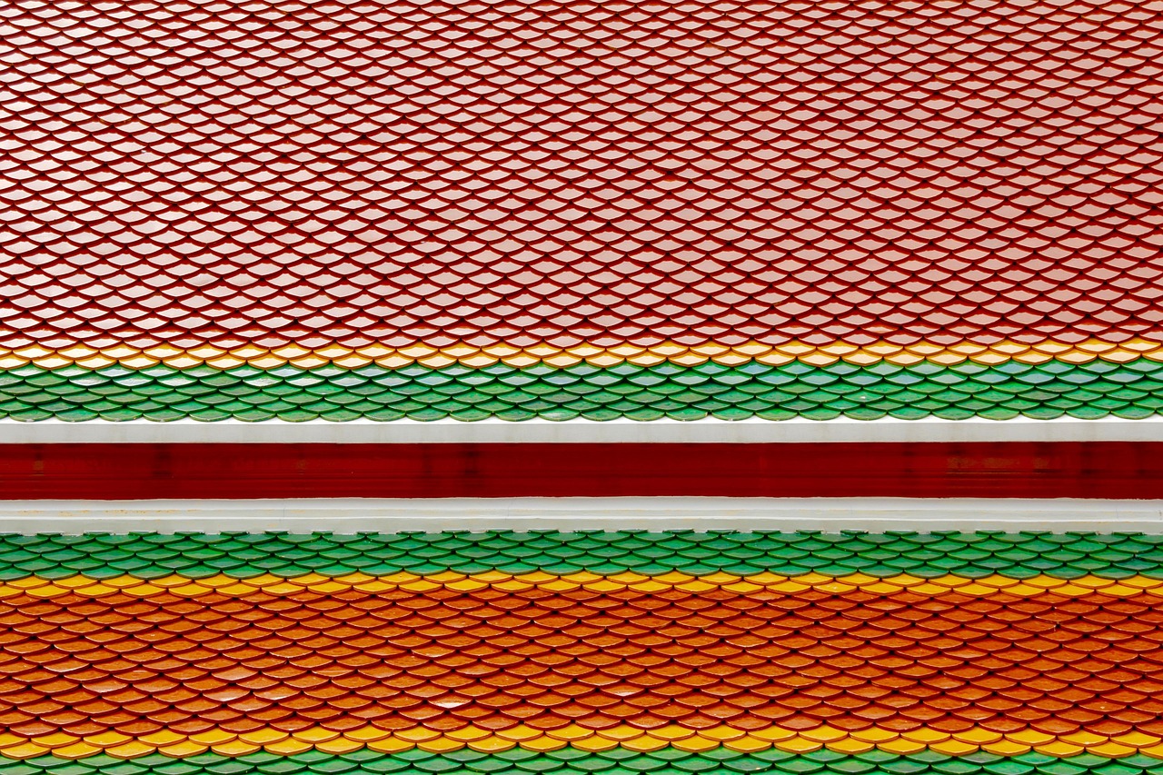 Golden spires and ornate gables showcase the grandeur of traditional Thai architecture.