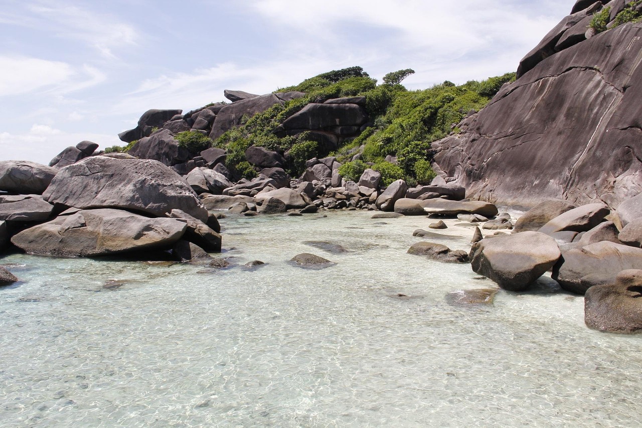 Stunning granite boulders frame the untouched beauty of Ao Kuerk Beach, a Similan gem.