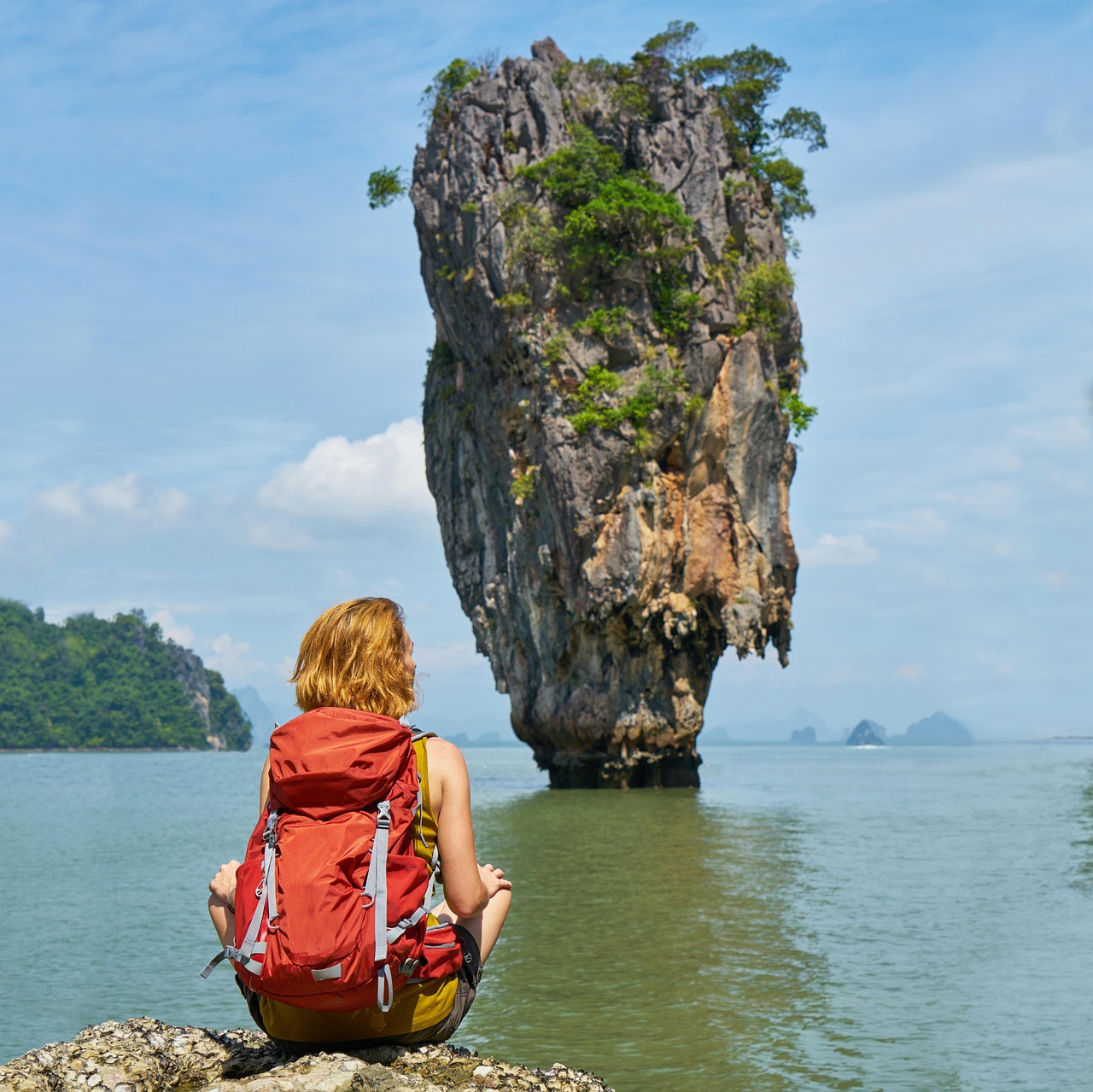 The dramatic karsts of Bond Island soaring above the emerald sea.