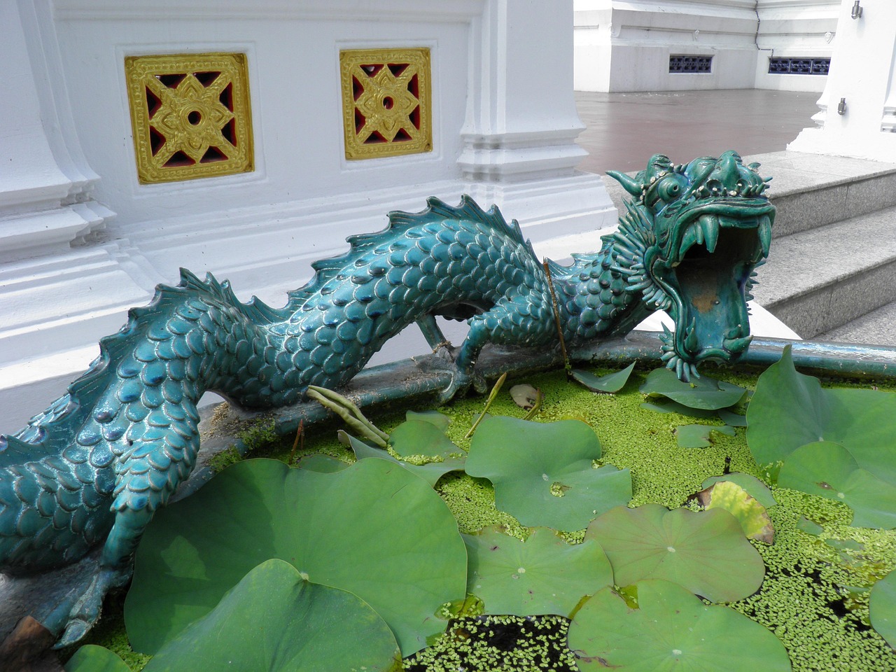 Lush gardens and tranquil lotus ponds provide a peaceful sanctuary from city life.