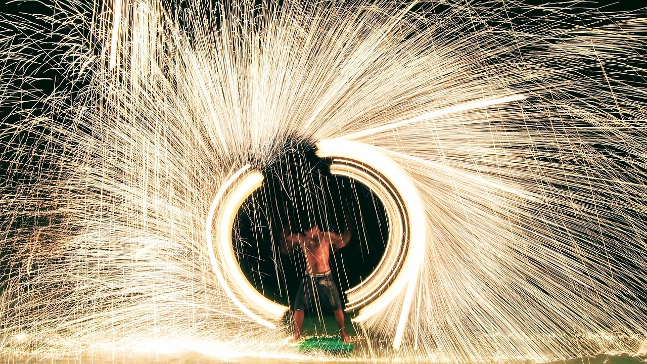 The sun sets as the vibrant nightlife awakens at Ao Phai Beach, Ko Samet.