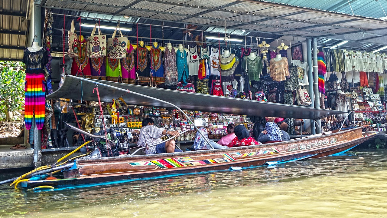 Colourful boats trade local produce at Damnoen Saduak Floating Market, Thailand's most famous water market.