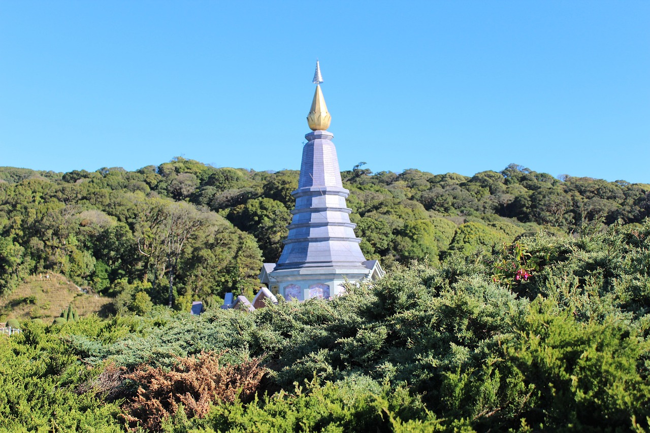 The iconic King and Queen pagodas on Doi Inthanon are surrounded by colourful gardens and mountain mists.