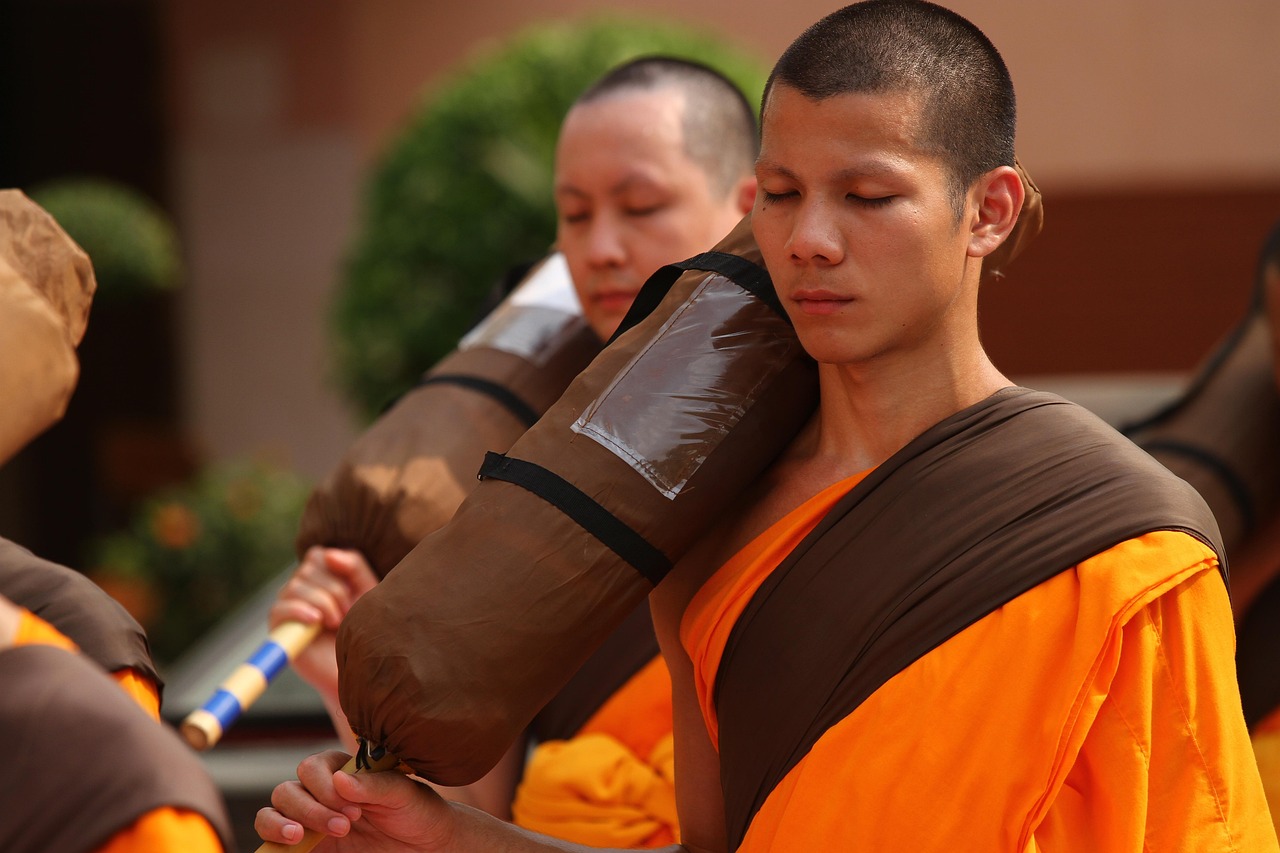 Buddhist devotees lighting incense at Wat Chalong—a timeless ritual filled with meaning.