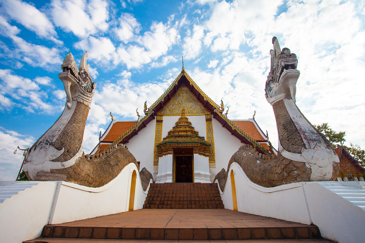 Moments of connection: A traveller chatting with a monk at Wat Chalong.