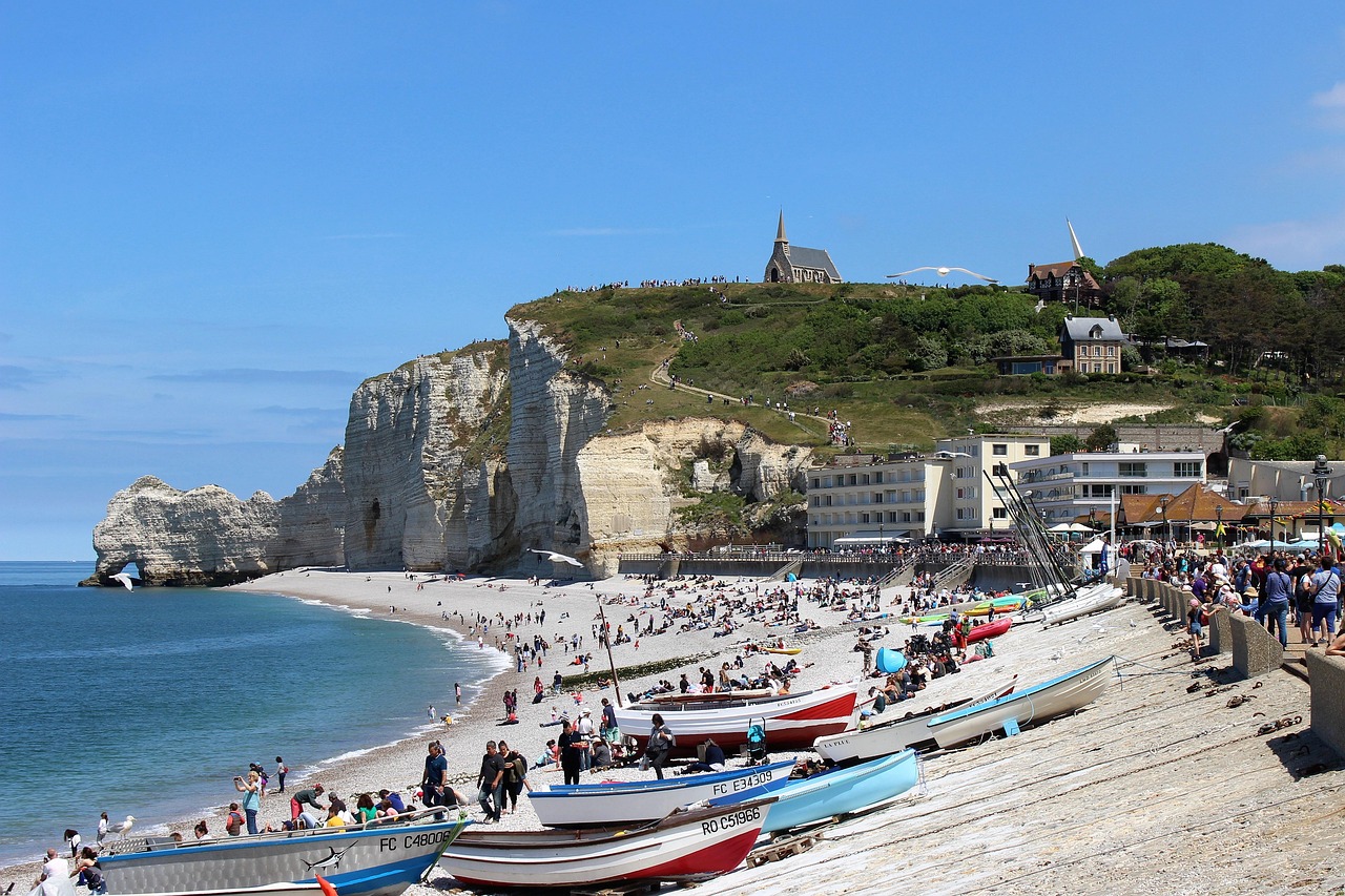 Etretat’s world-famous white cliffs rise above hidden pebbly coves—a landscape immortalised by artists.