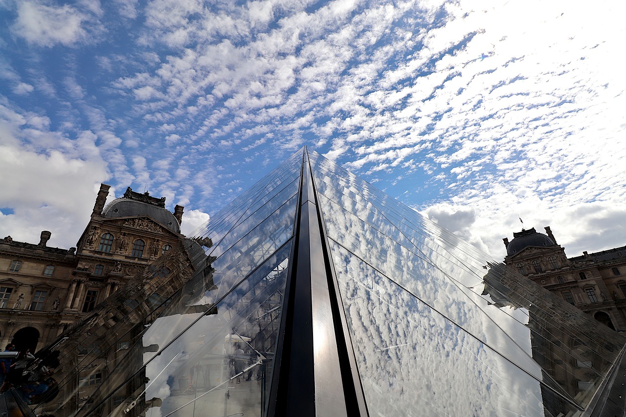 The Louvre Palace's magnificent evolution from fortress to iconic glass pyramid.