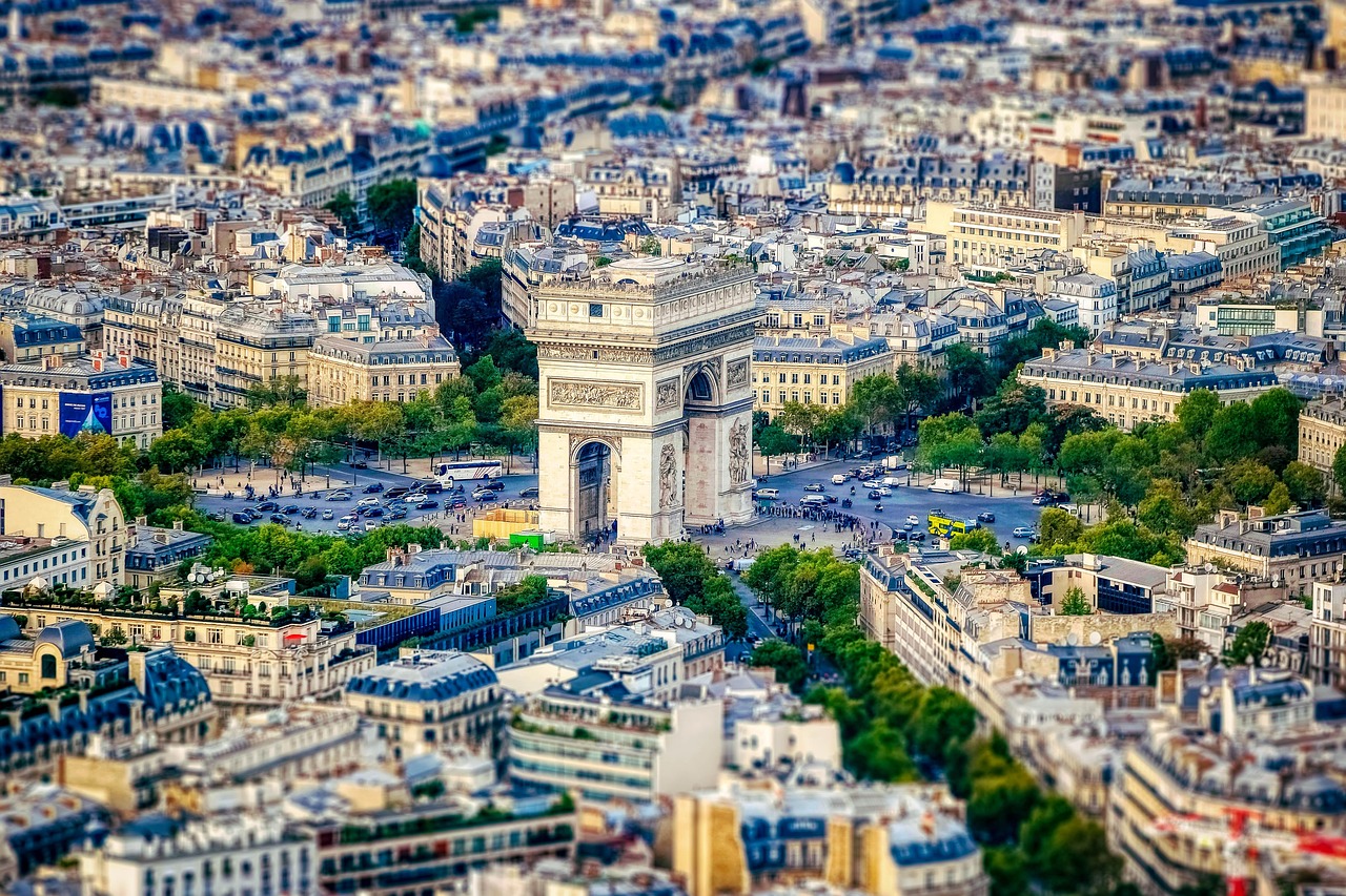 Evening on the Champs-Élysées: Paris’s grand avenue alive with theatres, elegant cafes, and sparkling lights.