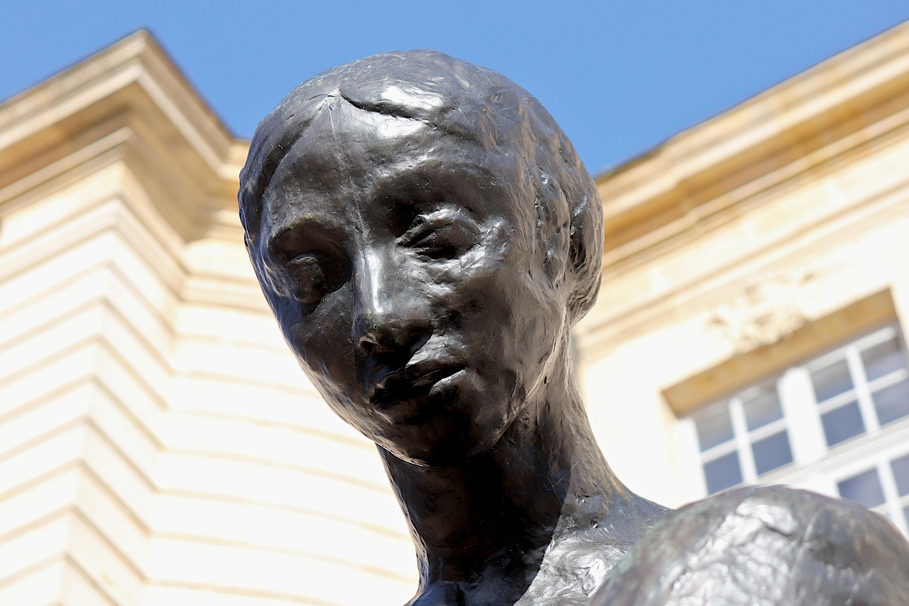 Sculptures are thoughtfully placed in the peaceful gardens, blending art and nature.