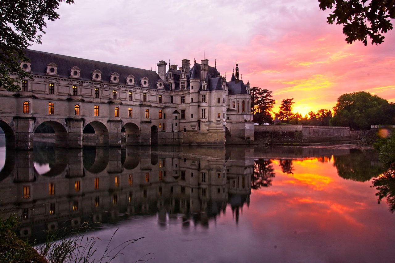 Château de Chenonceau charms with its arches spanning the River Cher and blossoming gardens.