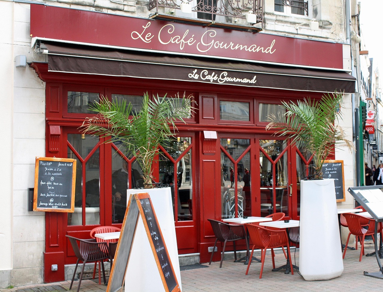 A Parisian café table set with delicate pastries and a steaming café crème.
