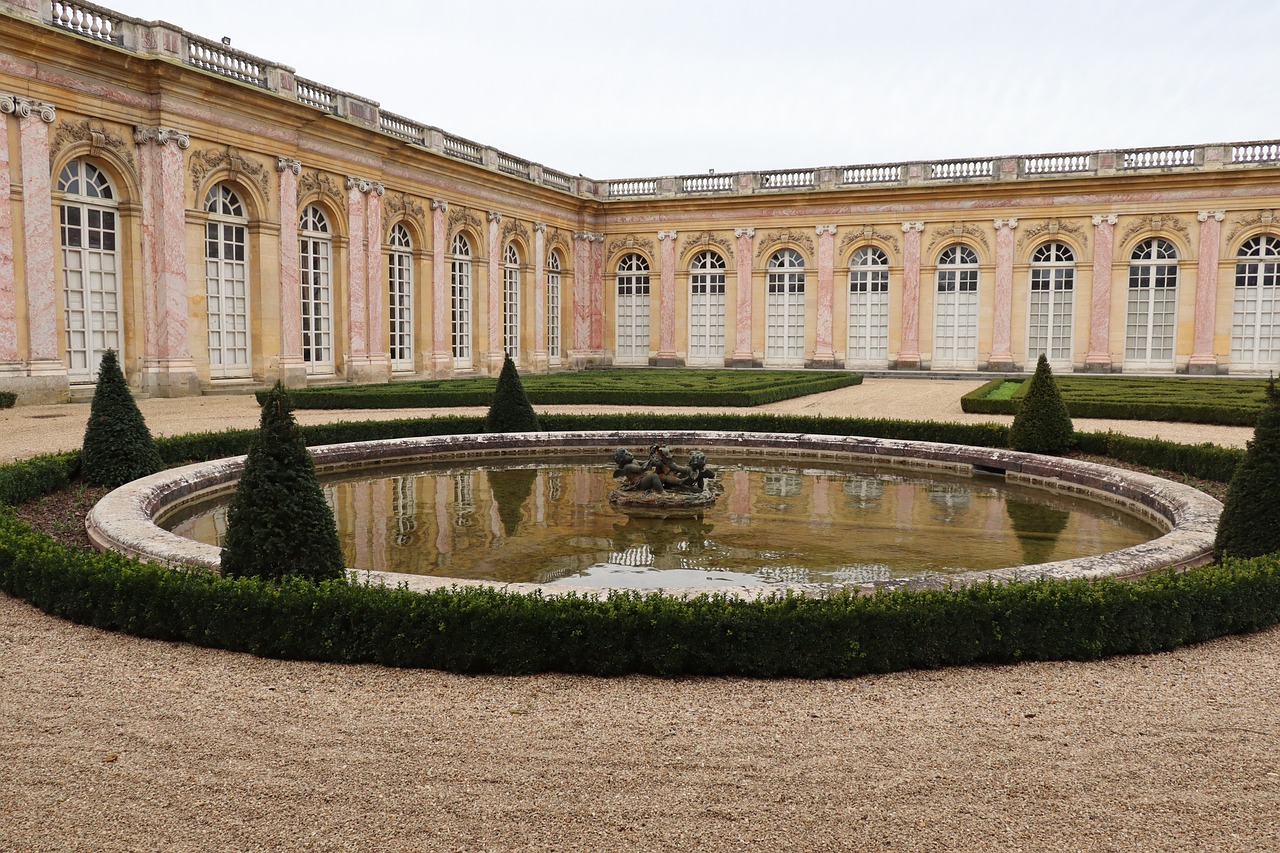 Visitor watching a fountain show in the gardens of Versailles