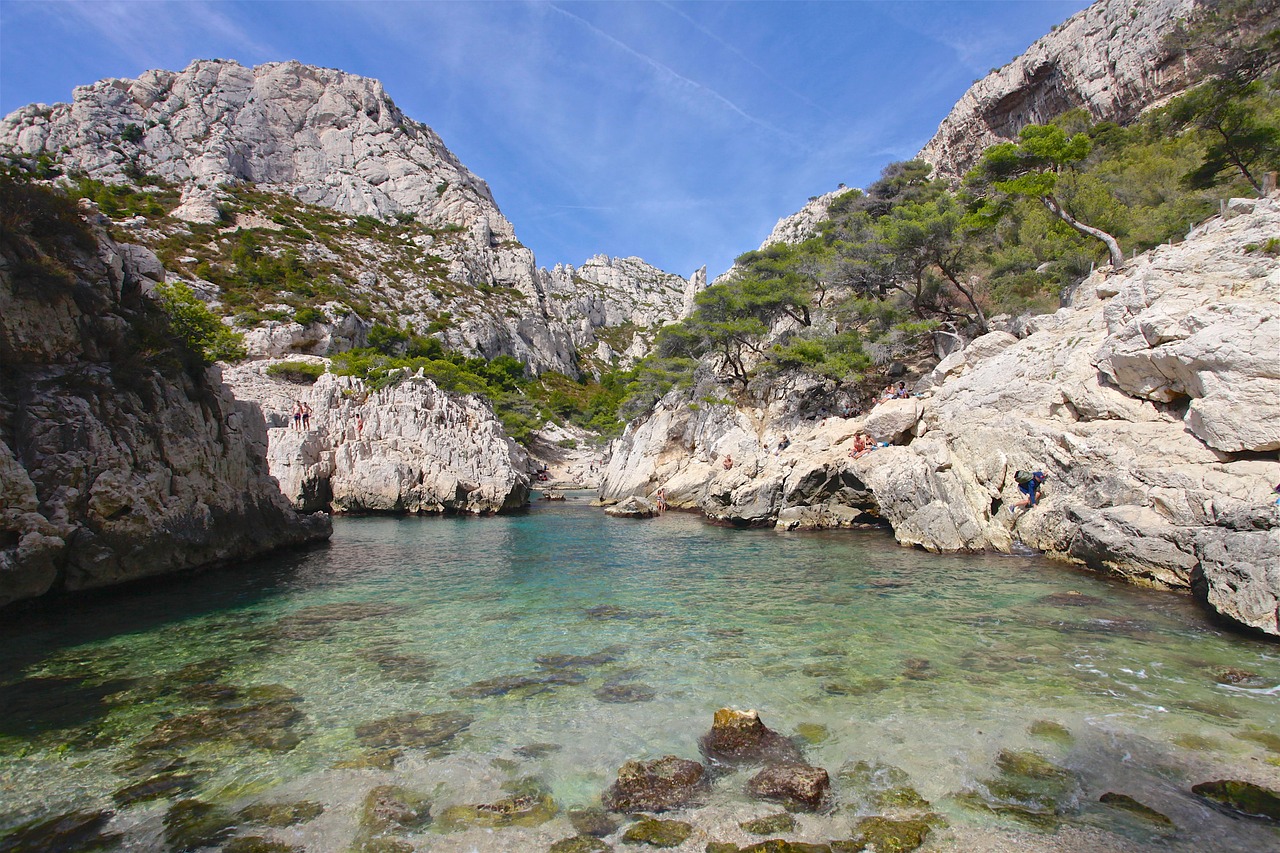 The enchanting Calanque de Sugiton: a tranquil turquoise escape framed by dramatic limestone walls.