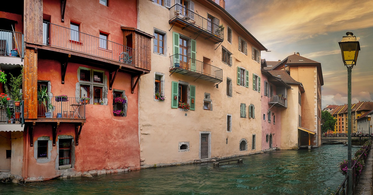 Old town canal strolls in the Vieille Ville of Annecy with pastel houses