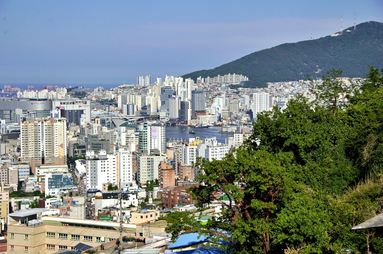 Busan October weather temperature average high average low rainfall humidity sunshine over the city skyline