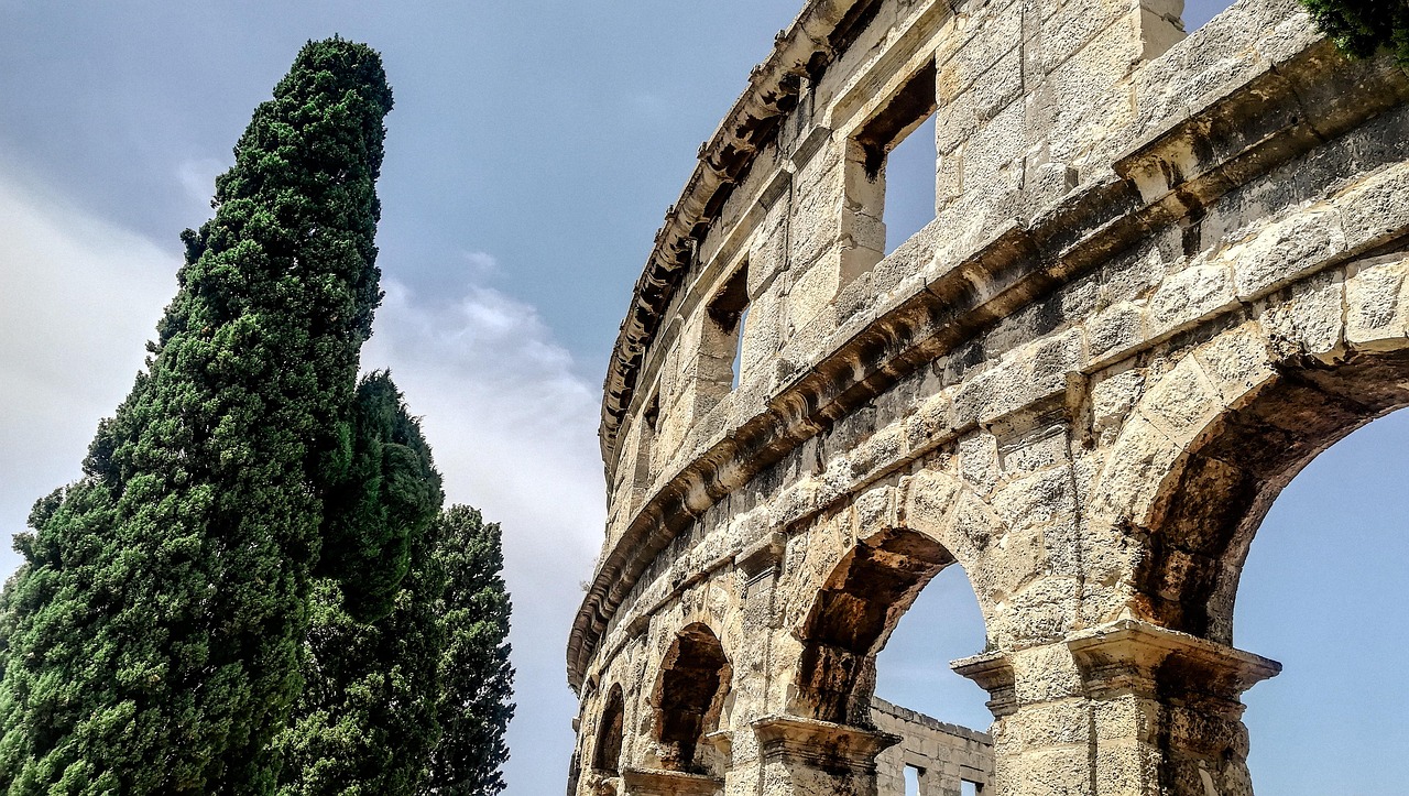 Ancient Rome Attractions Colosseum and Roman Forum at Sunset with an iconic amphitheatre view