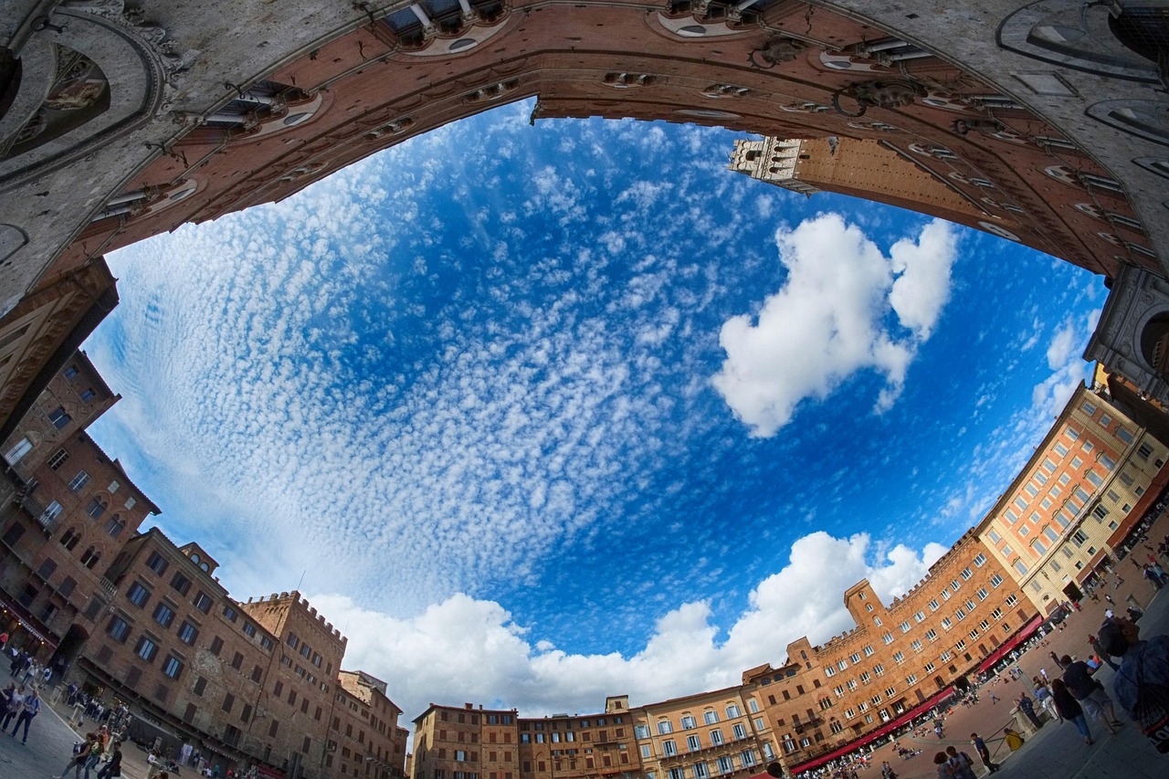 Piazza del Campo and the Palio di Siena with the Contrade in the iconic shell-shaped square