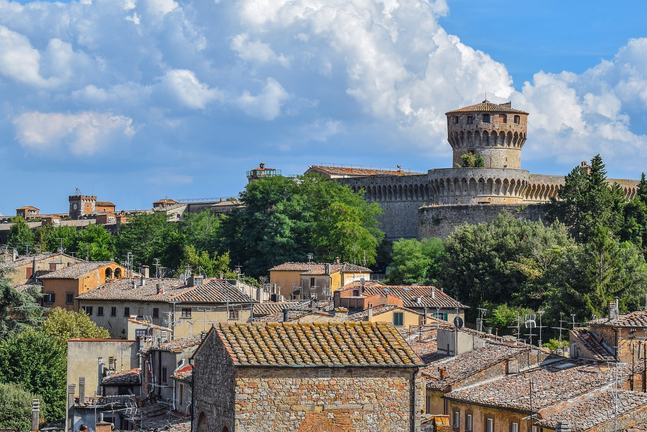 Why Volterra in Tuscany feels like a living time capsule across a hilltop town skyline at sunset