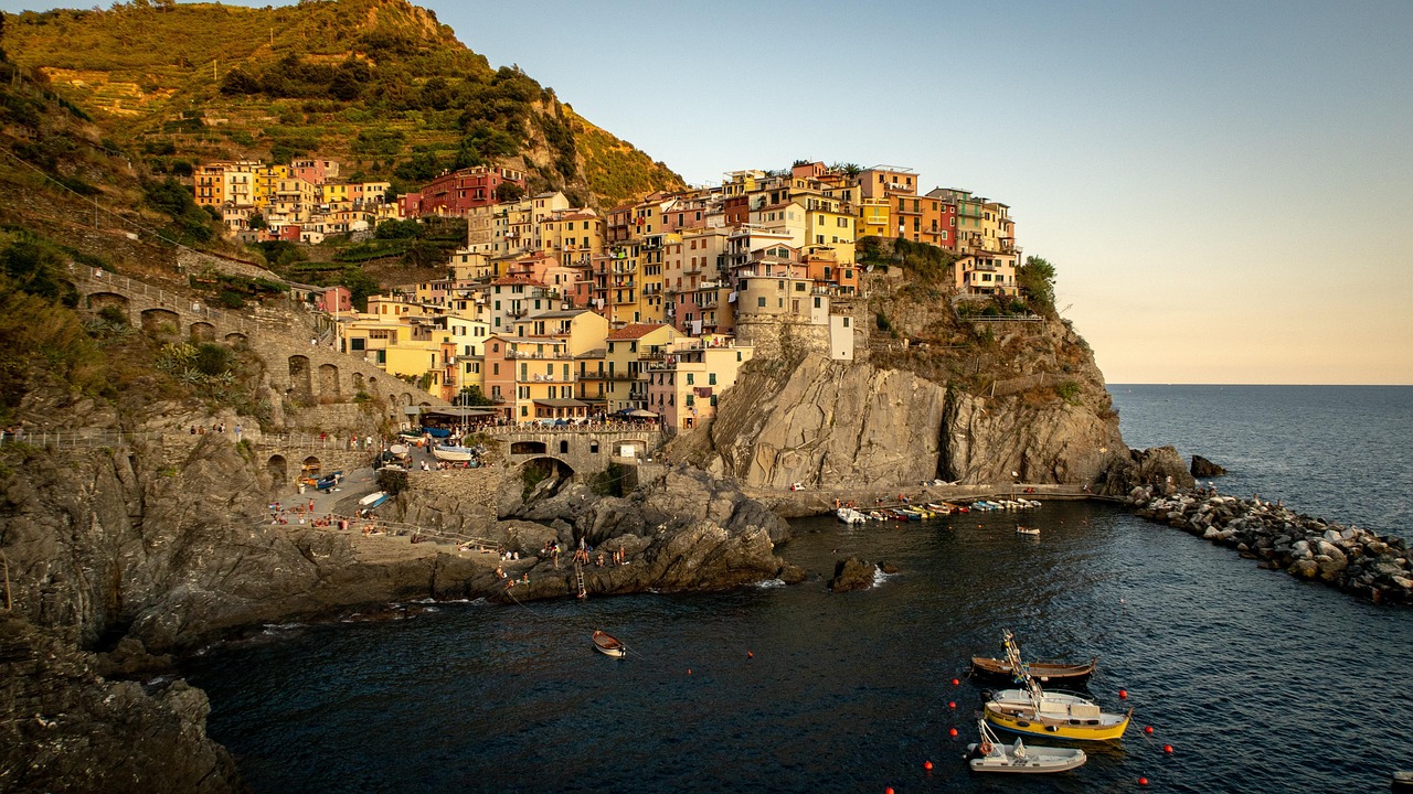 Manarola and Riomaggiore boats vineyards and sunset swims in Cinque Terre Italy