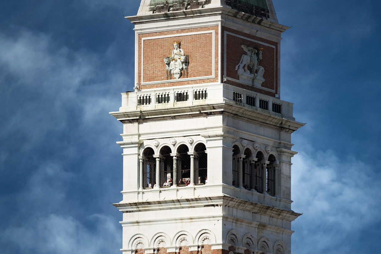 Campanile di San Marco Bell Tower Views at Sunrise with rooftops and lagoon beyond