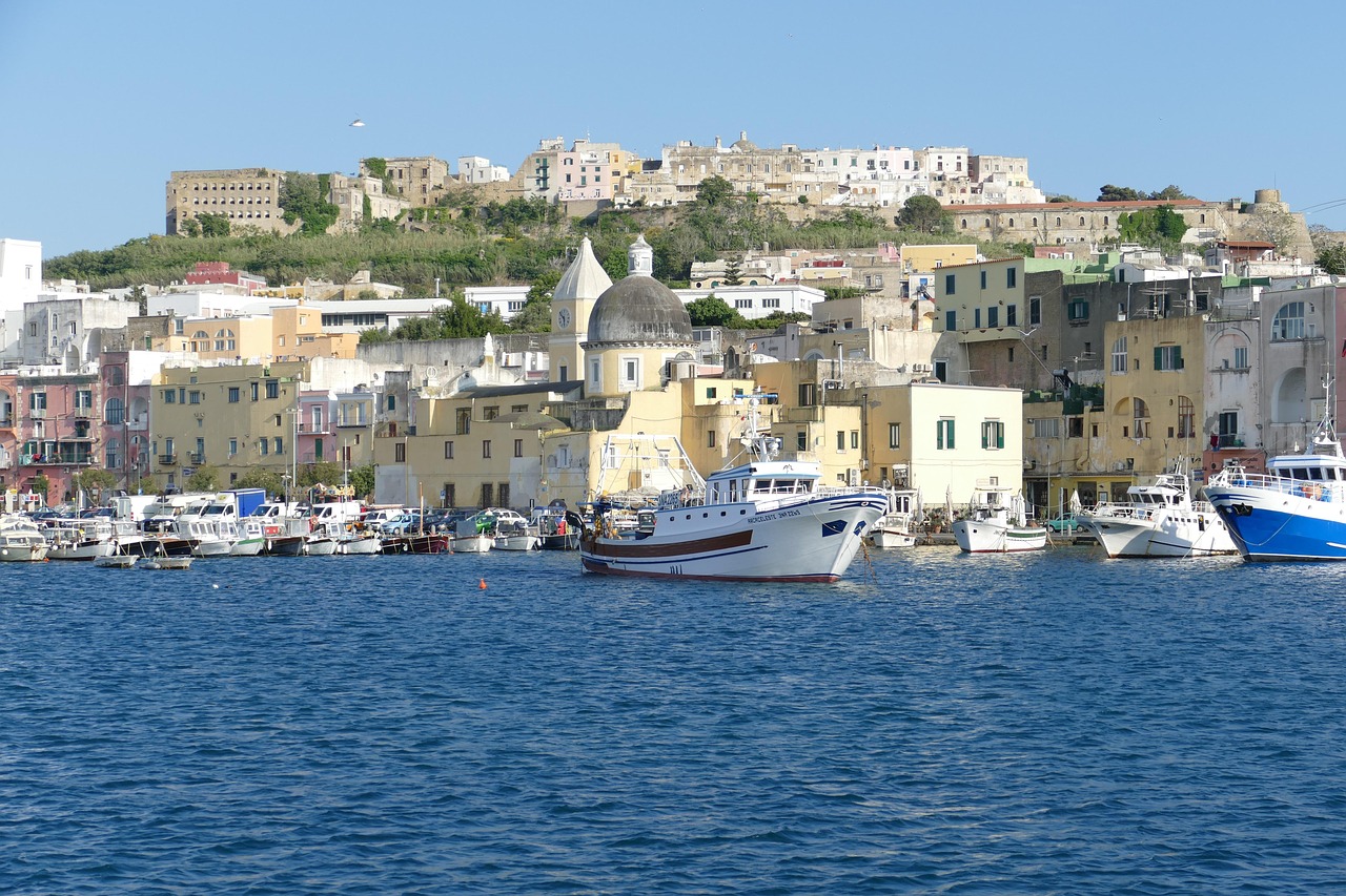 Baia coastline by boat, Tyrrhenian Sea and view toward Procida and Ischia islands