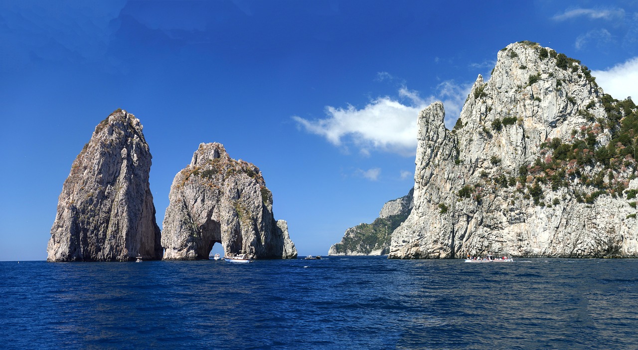 Best Time to Visit and When the Blue Grotto Is Closed with Faraglioni backdrop