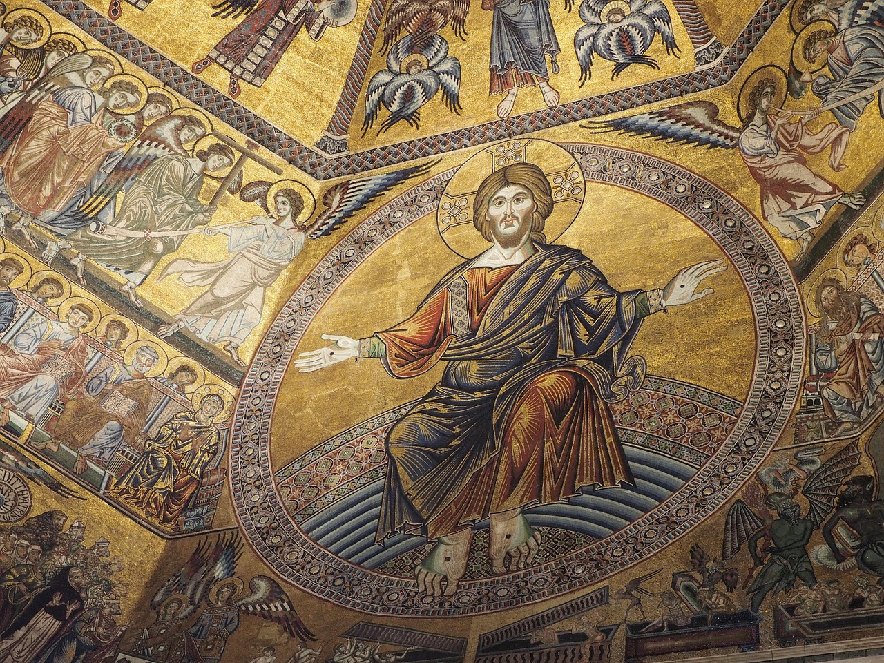 Inside the Basilica of Santa Croce in Florence with nave and chapel frescoes