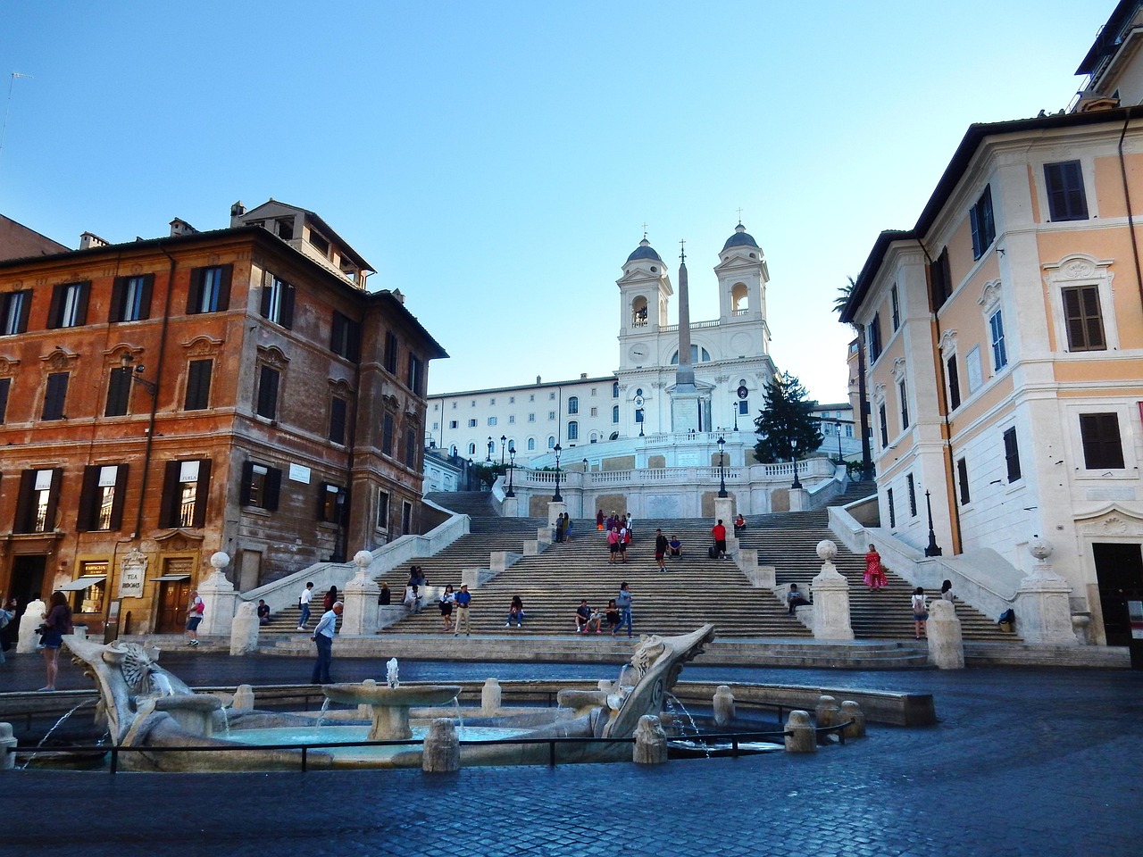 Visit Rome for Ancient Grandeur and Modern Luxury near the Spanish Steps at dusk