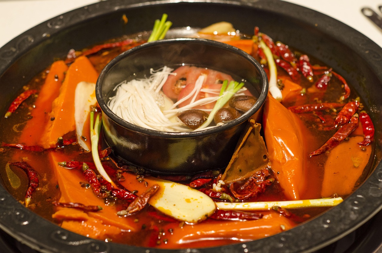 Chengdu Sichuan cuisine hotpot and noodle heat, lantern-lit streets and evening bites