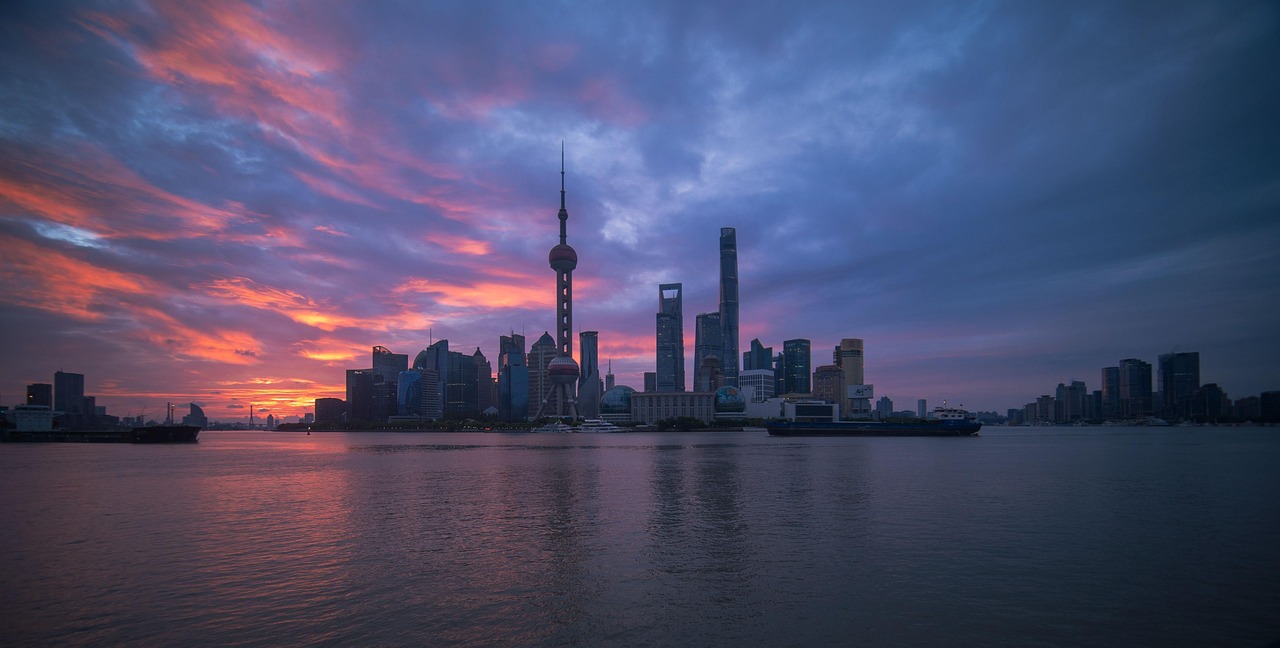 The Bund Waterfront Promenade and a Crafted Huangpu River Sunset with glowing city lights