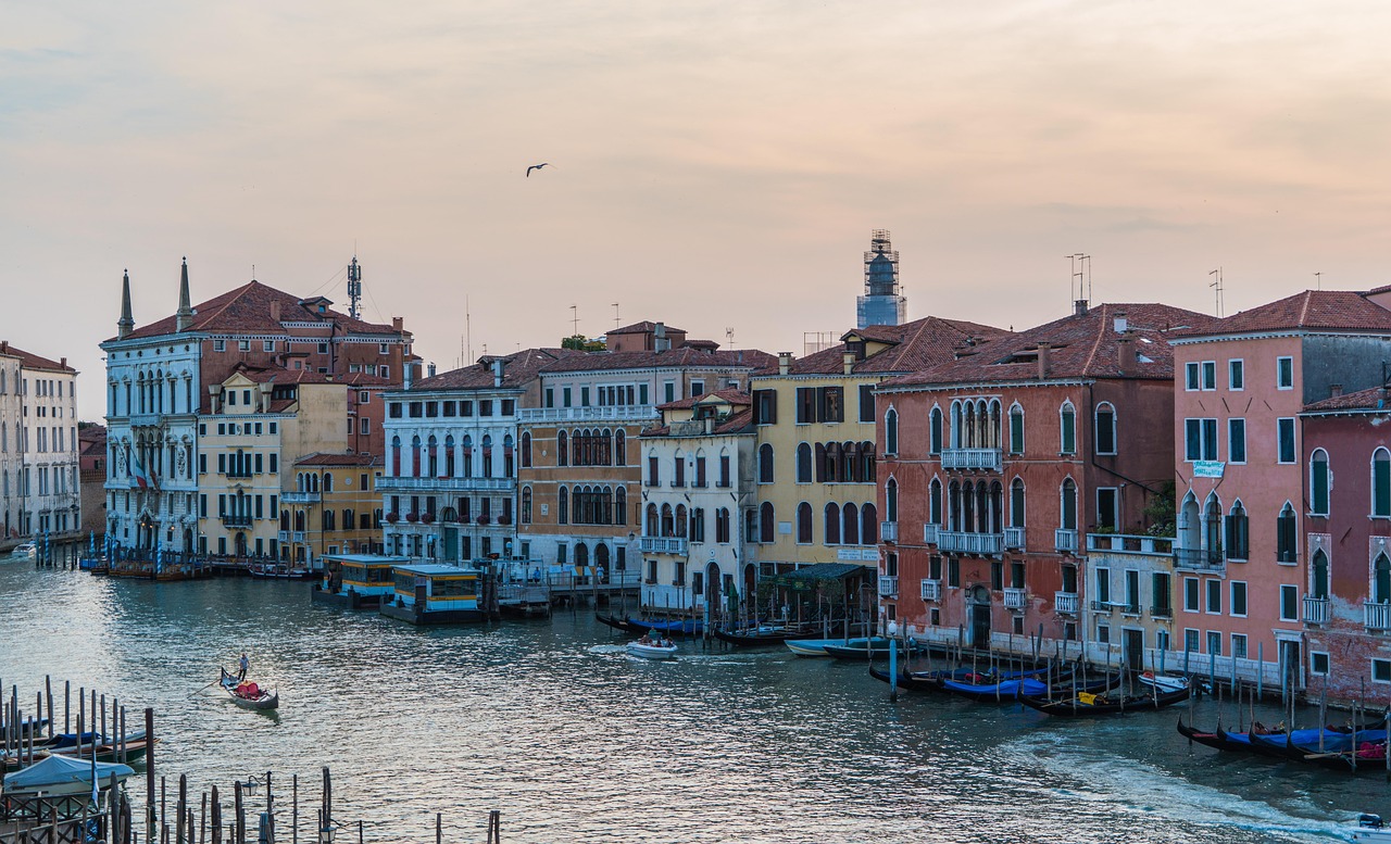Venice from the Water Private Gondola at Sunset with reflections along the Grand Canal