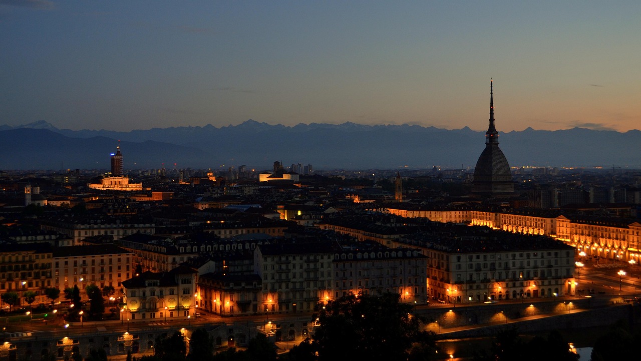 Mole Antonelliana and the National Cinema Museum at night with a panoramic view of Turin