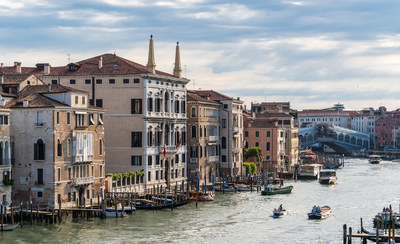 Venice from the water with palazzi lining the curve of the Grand Canal