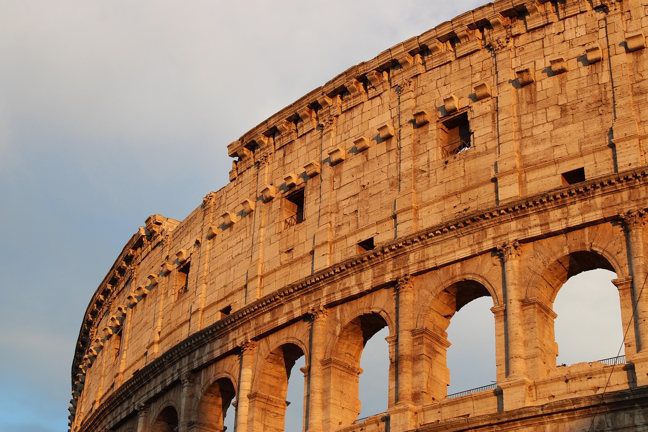 Rome for Ancient Grandeur and Living Piazzas with the Colosseum at golden hour